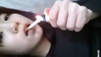 Young Asian girl smokes and poops