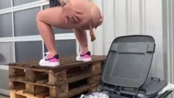 Blonde shit in a trash can