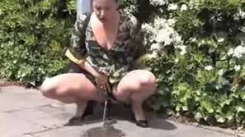 Cool Brunette piss in the street